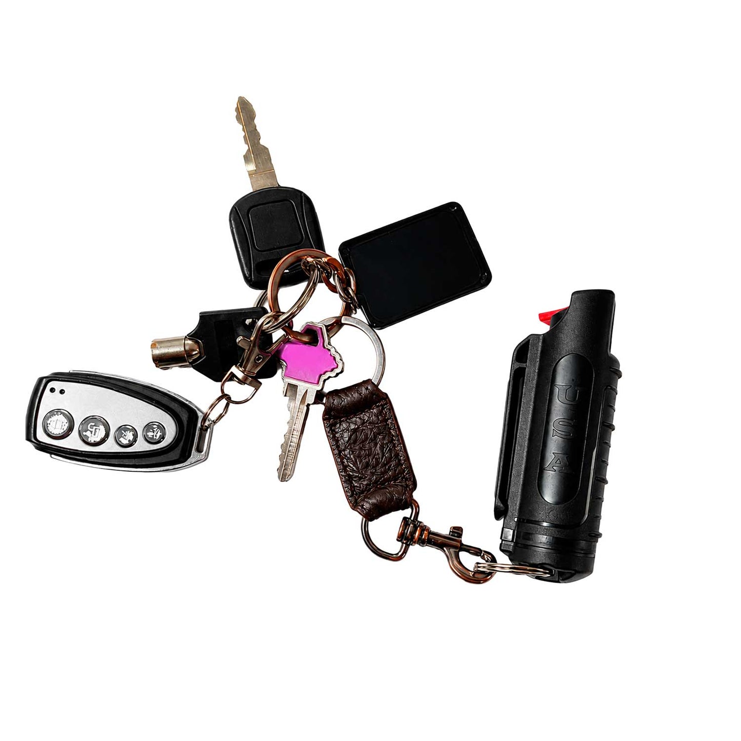Se muestra gas PSP Eliminator junto a unas llaves, comparando su tamaño compacto y demostrando que puede llevarse cómodamente como accesorio de protección personal.