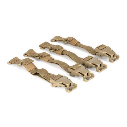 a set of four tan plastic straps on a white background